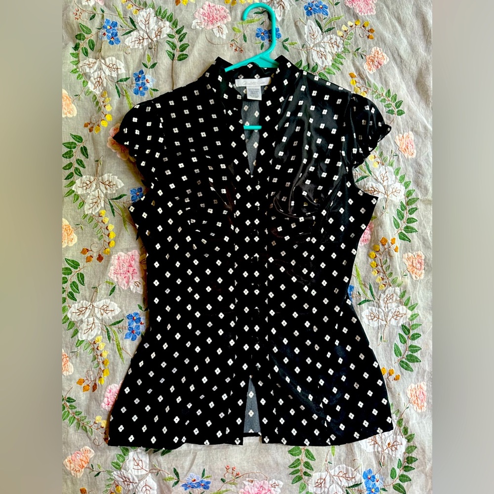 Charlotte Russe black top with white flowers size small.